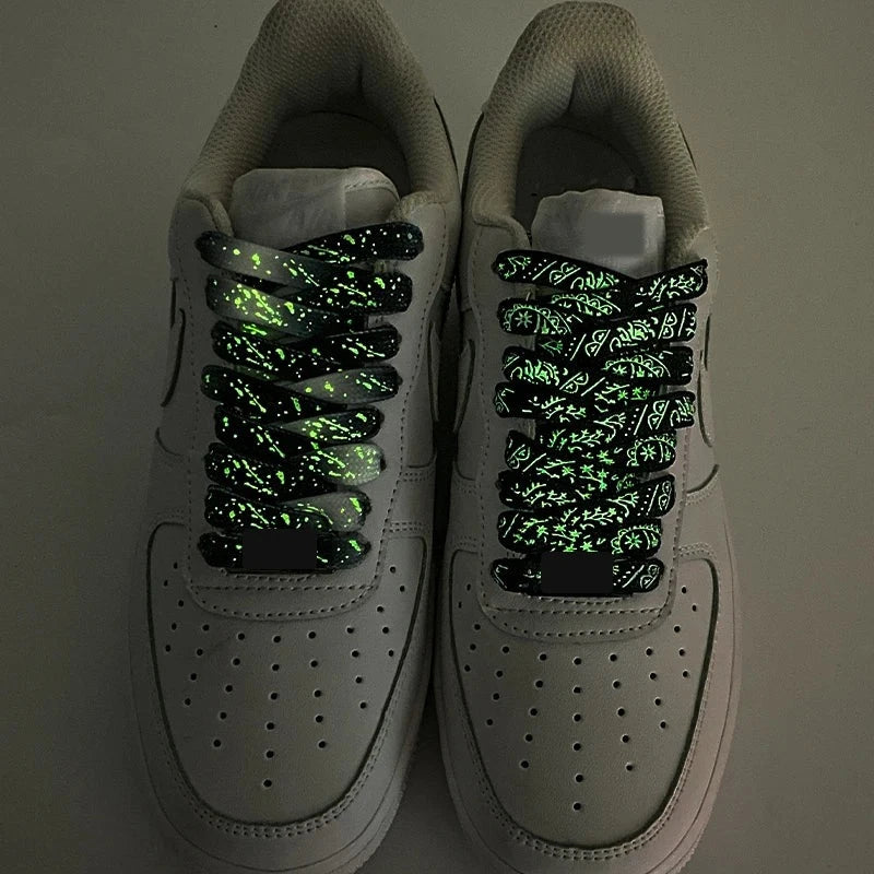 Pair of sneakers with glowing paisley shoelaces