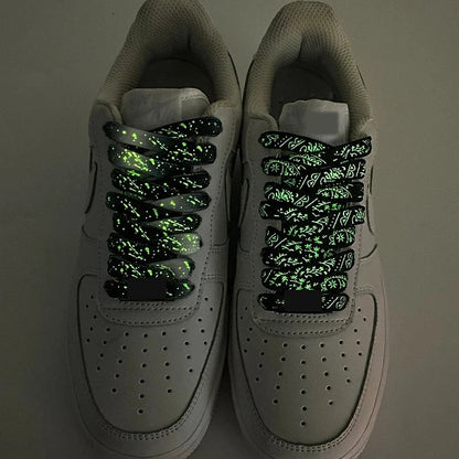 Pair of sneakers with glowing paisley shoelaces