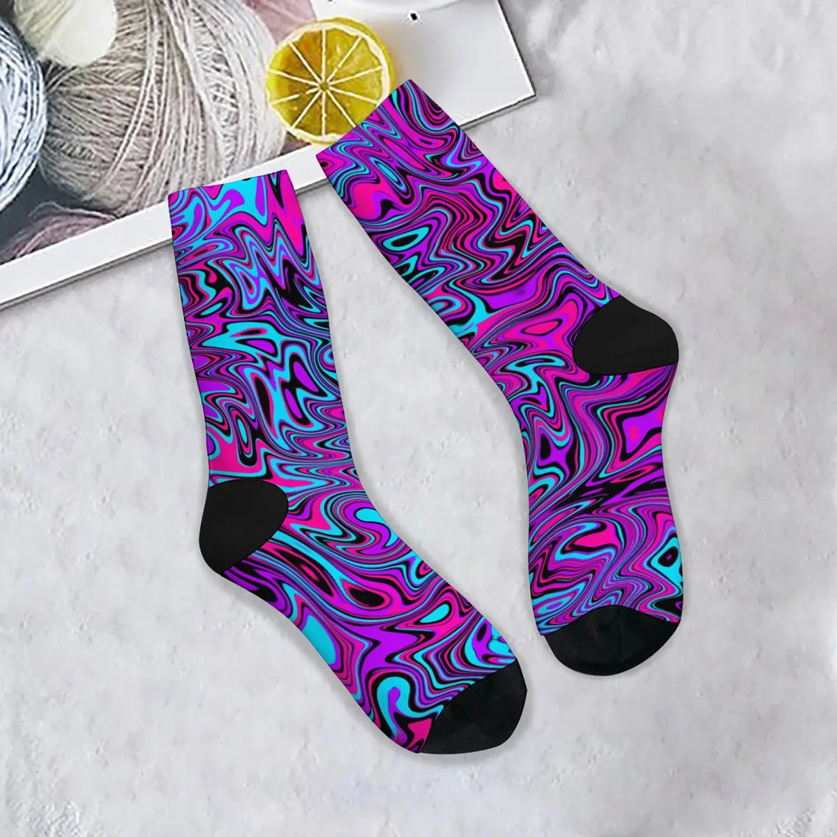 Psychedelic purple and blue swirl crew socks laid flat
